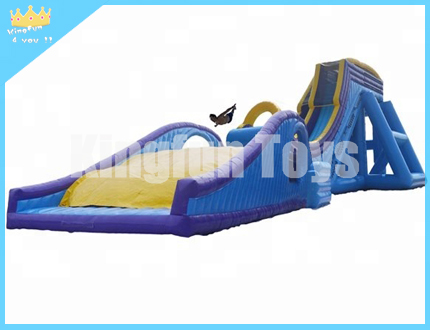 Inflatable drop kick slide